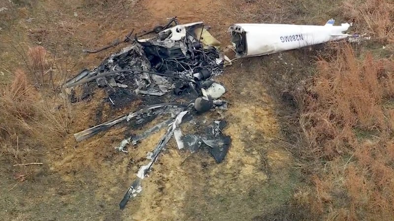 Debris from a helicopter is shown after two helicopters crashed in Hammonton, N.J., on Sunday,...